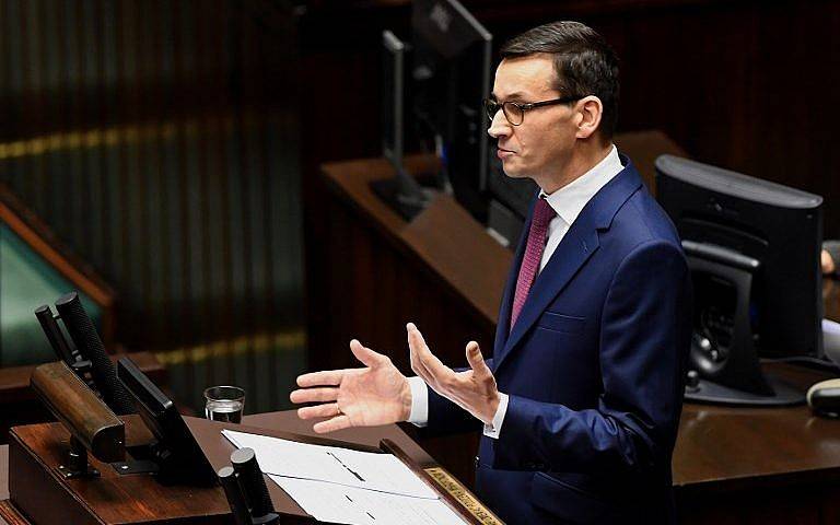 El primer ministro polaco, Mateusz Morawiecki, pronuncia un discurso ante los legisladores en el parlamento de Varsovia el 12 de diciembre. (AFP Photo / Janek Skarzynski)