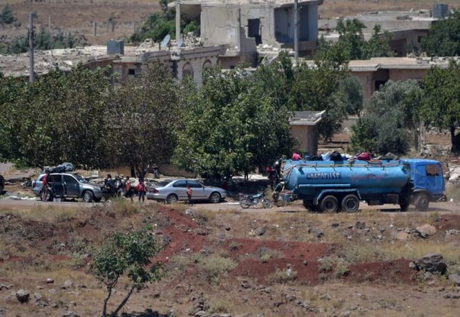 Rebeldes que salen de Quneitra en el lado sirio de los Altos del Golán, el 20 de julio de 2018. Crédito: Gil Eliahu