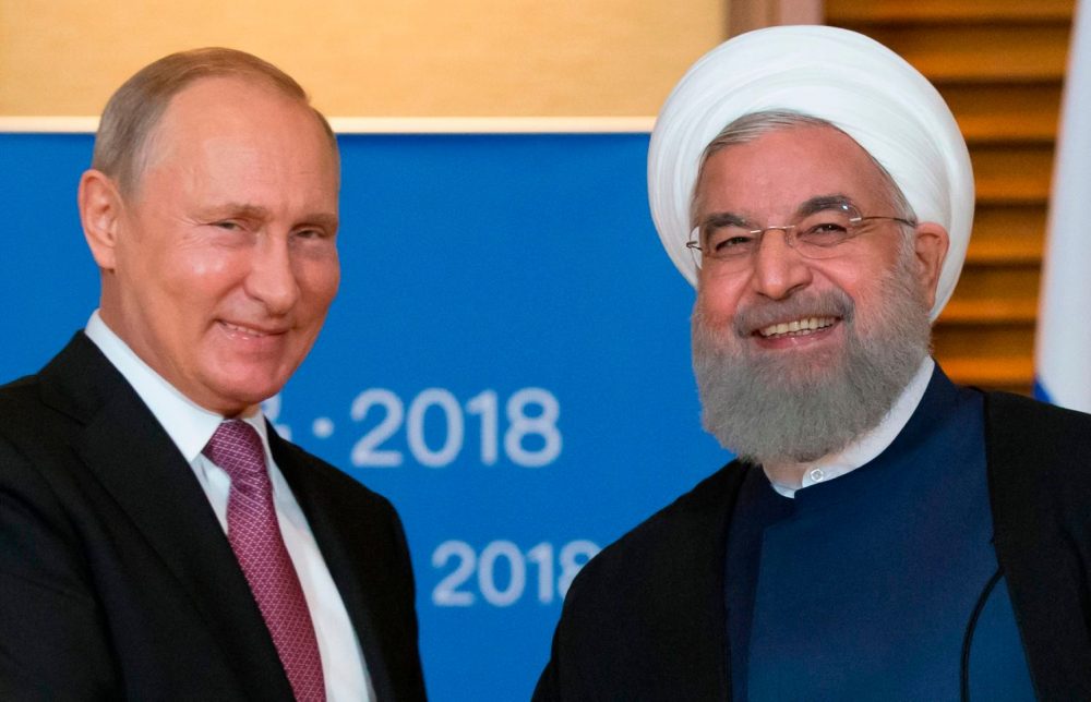 Putin se encuentra con Rohani al margen de la Cumbre de la Organización de Cooperación de Shanghai en Qingdao, el 9 de junio de 2018. Crédito: ALEXANDER ZEMLIANICHENKO / AFP