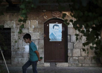 Con la victoria a la vista, carteles de Assad se amontonan en calles de Damasco