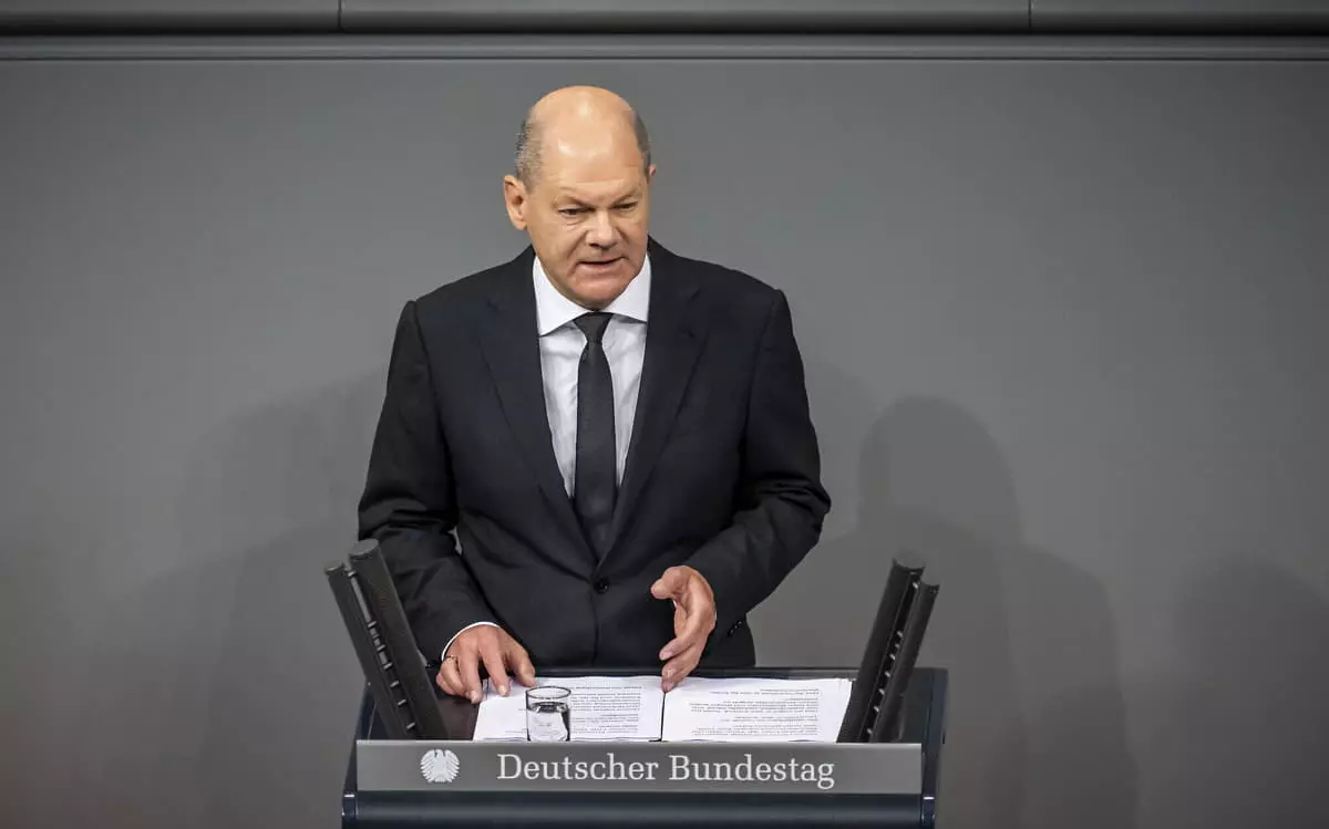 El canciller alemán Olaf Scholz pronuncia una declaración gubernamental sobre la situación en Israel durante una reunión del Parlamento federal alemán, Bundestag, en el edificio del Reichstag en Berlín, Alemania, el 12 de octubre de 2023. (Michael Kappeler/dpa vía AP)