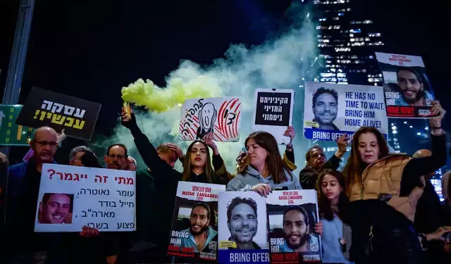 Demonstrators protest calling for the release of Israeli hostages held in the Gaza Strip, in Tel Aviv, March 26, 2024. (Chaim Goldberg/Flash90)