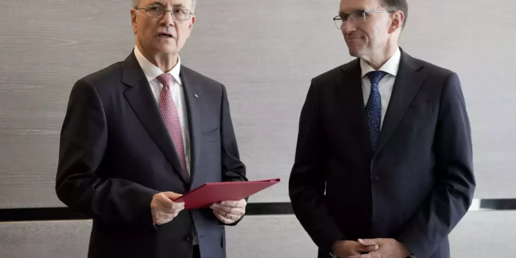 Palestinian Authority Prime Minister Mohammed Mustafa, left, after receiving a document handed over by Norway's Foreign Minister Espen Barth Eide, right, prior to a meeting for talks on the Middle East in Brussels, May 26, 2024.(AP Photo/Virginia Mayo)