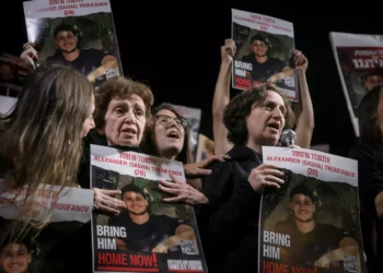Freed hostages Yelena Trufanov, right, speaks next to her mother Irena Tati at a rally calling for the release of Israelis held hostage by Hamás terrorists in Gaza, in Hostage Square in Tel Aviv, December 2, 2023. (Miriam Alster/Flash90)
