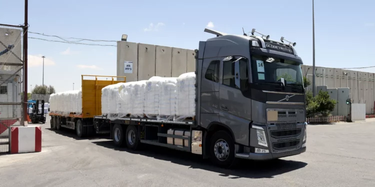 A truck carrying humanitarian aid for the Gaza Strip crosses the Kerem Shalom border crossing between southern Israel and Gaza, May 30, 2024. (Jack Guez/AFP)