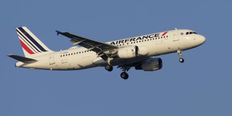 An Air France Airbus A320 approaches for landing in Lisbon at sunrise, Tuesday, Oct. 10, 2023. (AP Photo/Armando Franca)